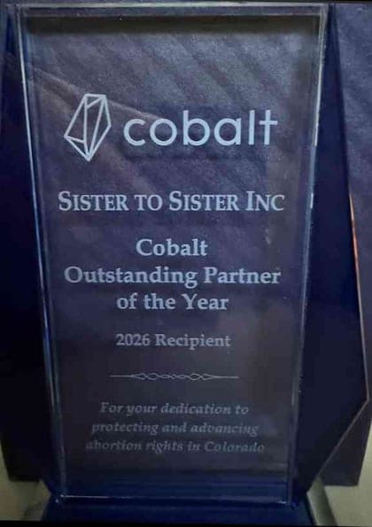 Glass award engraved Cobalt Outstanding Partner of the Year, 2026 Recipient, Sister to Sister Inc